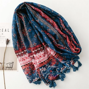 Vintage bohemian linen scarf with blue and red floral patterns and tassel trim