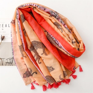 Orange leopard print lightweight scarf with pink tassels and animal pattern design