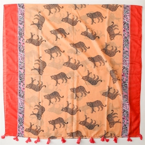 Orange leopard print scarf with red borders and fringe tassels on a white background