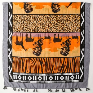 Ethnic animal print shawl featuring giraffe and elephant patterns with tassel fringe