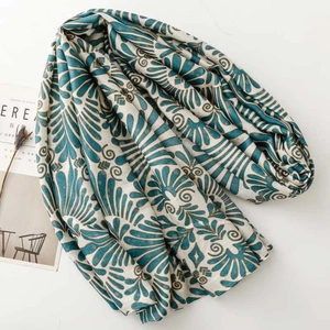 Teal and gold floral pattern cotton linen scarf with frayed edges for winter fashion