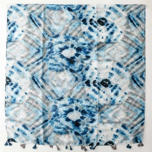 Blue tie-dye effect lightweight voile scarf with tassels for women, front flat lay view