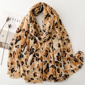 Cotton linen feel leopard print scarf with gold foil accents and frayed edges