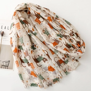 Close-up of cat print long scarf with fringe edge and winter kitten pattern detail