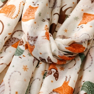 Detail view of cat paradise print scarf showing soft woven fabric and cute kitten pattern