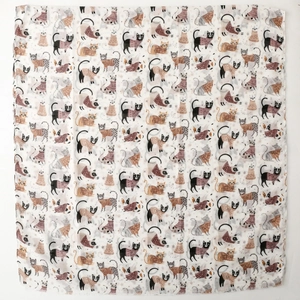 Detail of cartoon cat print on white scarf featuring delicate raw fringe edges