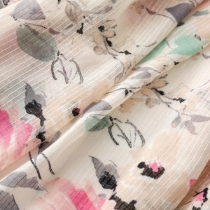 Detail of pink floral prints on textured cotton linen scarf with soft bamboo yarn weaving