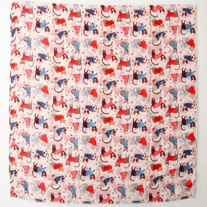 Detail of pink cat print silk scarf showing fine stitching and cartoon kitten patterns
