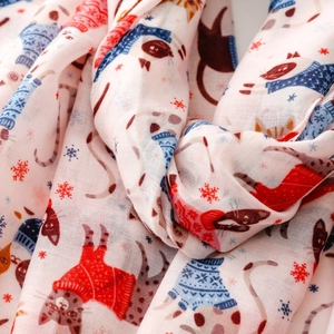 Close-up detail showing the soft fabric texture and cartoon cat print on the long scarf