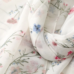 Close-up of lightweight floral scarf showing semi-transparent fabric and soft texture