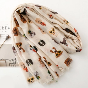 Detail of dog print scarf with tassels next to lifestyle props on white background