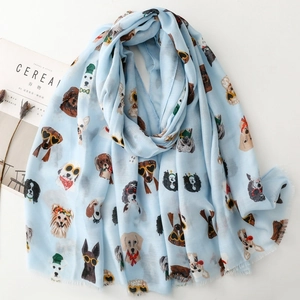 Light blue scarf featuring cartoon dog prints with sunglasses and natural frayed edges