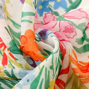 Close-up of lightweight Bali yarn fabric with vibrant floral print and woven texture