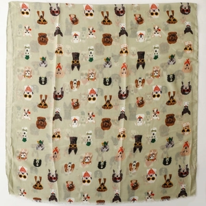 Detail shot of light grey-green scarf featuring cute dog and sunglasses print with frayed edges