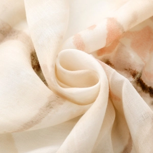 Macro detail of ink painting butterfly print scarf showing soft texture and drapes