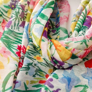 Close-up of lightweight Bali yarn scarf showing colorful floral patterns and soft texture