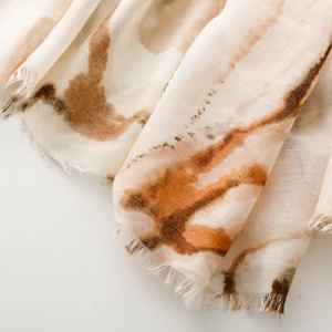 Detail showing the abstract ink wash texture and fringe edges on this cotton satin scarf