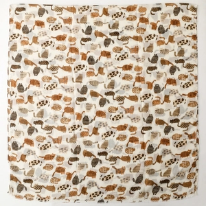 Detailed close-up of cute cartoon cat prints on a lightweight satin cotton scarf