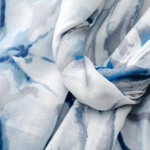 Detail of soft silk-cotton scarf featuring blue and grey abstract ink painting patterns