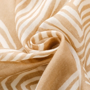 Detailed close-up of woven cotton linen fabric with striped pattern and soft texture