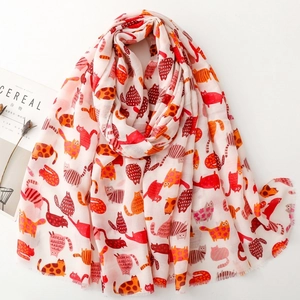 Pink scarf with cartoon cat prints and fringe edges on minimalist white background