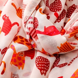 Detailed view of pink cat print silk scarf showing soft fabric texture and cute patterns