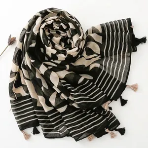 Modern cotton linen scarf with black and white geometric patterns and tassel edges