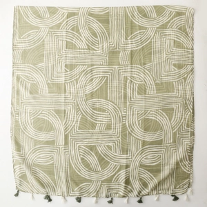 Macro detail of the light green scarf showing soft cotton-linen texture and white geometric lines