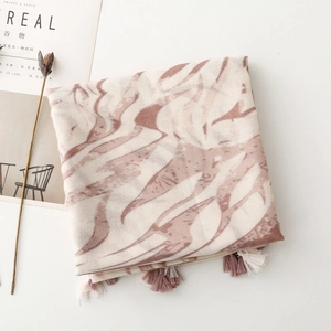 Detailed view of elegant marble pattern scarf with soft fringe edges and lightweight fabric