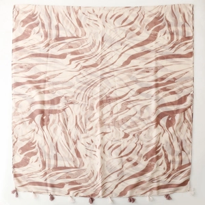 Brown and beige wave pattern pashmina scarf with tassel trim spread on white background