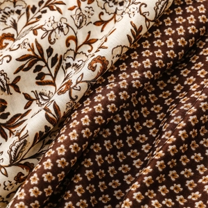 Detailed macro view of soft floral cotton linen fabric with intricate vintage pattern
