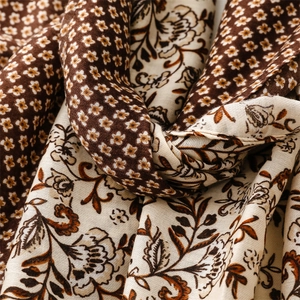 Close-up of soft cotton-linen feel scarf with vintage floral and ditsy patterns