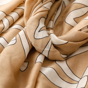 Detail showing the soft texture and abstract geometric lines of the linen cotton scarf