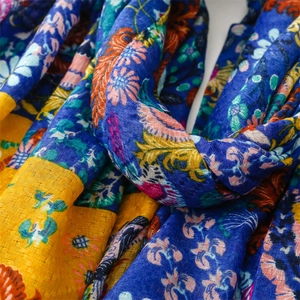 Detail of bohemian floral print scarf showing textured cotton linen fabric and vivid colors