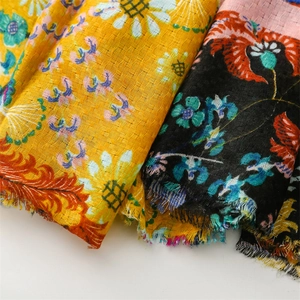 Close-up of linen-feel sunflower scarf showing the texture and frayed edge fringe details