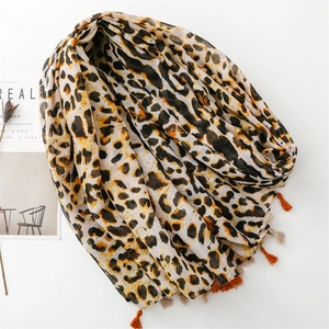 Fashionable leopard print scarf with orange tassels and cotton-linen texture