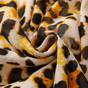 Lightweight cotton linen shawl with yellow leopard print pattern and soft texture