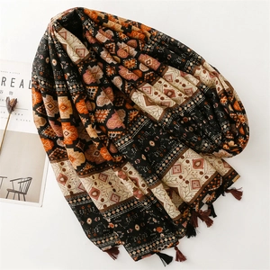 Bohemian geometric print cotton scarf with fringe details on a minimalist background