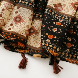 Detail view of Bohemian geometric print scarf with linen feel and fringe tassels