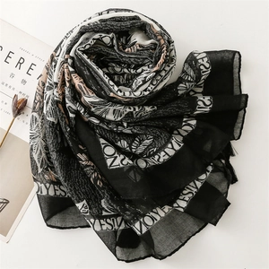 Linen feel scarf with botanical leaf print and YES typography for sun protection