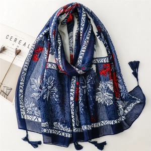 Chic cotton-linen feel scarf with blue leaf prints and decorative fringe tassels