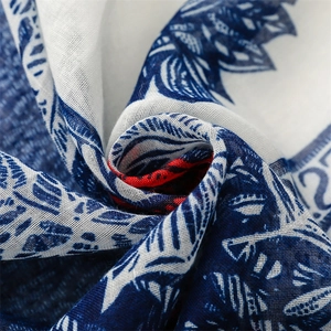 Macro view of blue and white leaf print linen-feel scarf fabric texture and weave