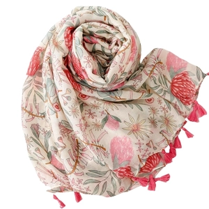 Linen feel floral scarf with red blossoms and pink tassel trim on a white background