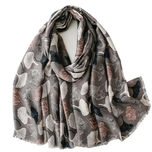 Gray cotton-linen scarf with white and caramel ginkgo leaf print and frayed edges