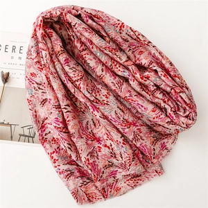 Close-up of soft cotton-linen scarf with floral print and frayed edge detail