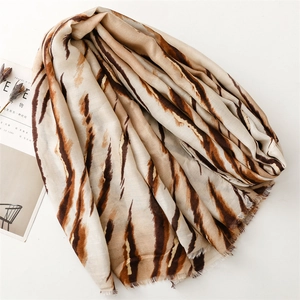Close-up of zebra pattern scarf showing soft cotton linen texture and frayed edges
