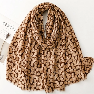 Brown cotton linen scarf with golden ginkgo leaf patterns and fringe edges