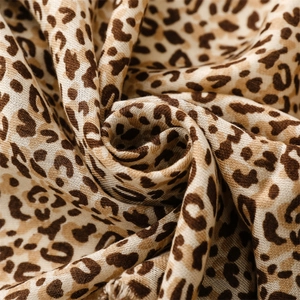 Macro detail of the soft cotton-linen leopard print scarf with fine weave texture