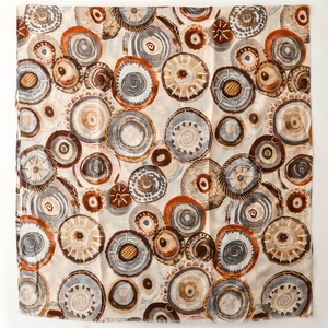 Detail of linen-feel shawl featuring abstract metallic gold bubble and geometric patterns