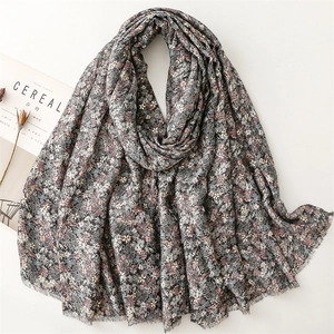 Elegant floral print cotton linen scarf for women featuring fringe edges and soft texture